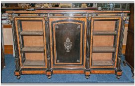 A Victorian Black Ebonised Ormalu Credenza with walnut cross banding with a central cupboard door