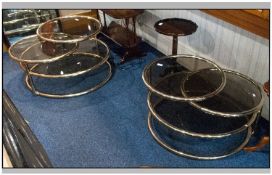 A Pair Of Contemporary Brass Adjustable Round Coffee Tables With Smokey Glam Inset Tops.