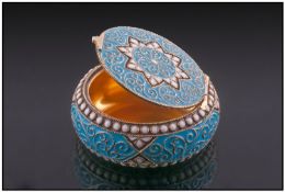An Exquisite Silver Gilt and Enamel Cachou Box. The hinged lid and sides decorated in turquoise