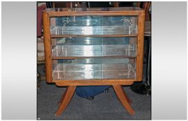 1950's Walnut Deco Glazed Front Display Cabinet of unusual splayed out legs. 38 by 42 inches.
