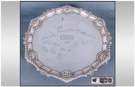A Georgian Style Silver Salver, With moulded shaped edge, centre engraved signatures & 'BMK 1964'.