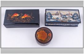 Three Various Eastern European Papier Mache Boxes comprising two rectangular and one circular. One