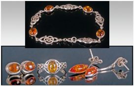Collection Of Silver Amber Set Jewellery. Comprising bracelet, ring, two pairs of earrings.