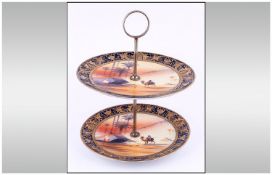 Noritake Signed And Hand Painted Two Tier Cake Stand. Desert scenes, signed S Maki. Stands 10 inches
