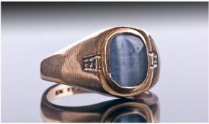 Gents 9ct Gold Signet Ring, set with an Oval Grey Polished Stone Between 2 Small Diamond Chips,