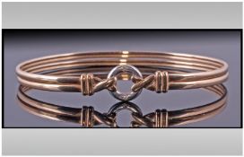 9ct Gold Bangle, fully hallmarked, small size and set with two small diamonds to centre. 7.1grams.