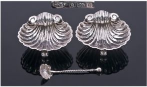 Edwardian Pair Of Silver Salts In The Form Of Sea Shells. Each raised on three ball feet, with