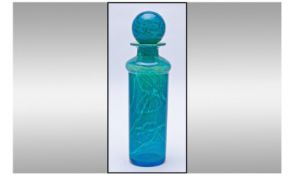 Mdina Column Shaped Bottle and Globe Stopper, the swirling pattern rising from a deep blue turquoise