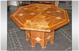 An Unusual Octagonal Shaped Centre Dining Table, with inlaid marble panels and lining, on an