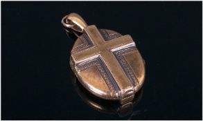 Victorian Oval Gilt Metal Locket. The front and back with moulded cross design, registration
