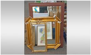 Three Modern Decorative Wall Mirrors, all framed. Two with bevelled glass, largest 24 x 29 inches.