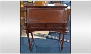 A Reproduction Mahogany Fall Front Bureau, on a turned leg base. Column sides to bureau with fully