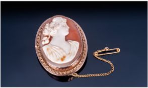 Edwardian 9ct Gold Framed Shell Cameo. With attached 9ct gold safety chain. Height 1.5 inches.