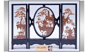 Chinese Carved Cork Triptych, two natural cork landscapes with oriental buildings, sandwiched