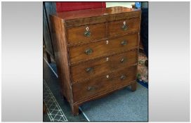 Mid Nineteenth Century Chest, two short over three long drawers with ivory estchuteouns, brass