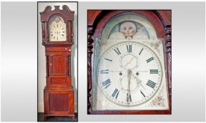 A Large Mahogany Victorian 8 Day Grandfather Clock. With an rolling moon painted dial. Maker