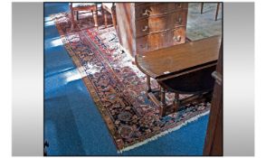 Large Room Size Wool Rug. Predominantly red/brown in colour with geometric design.