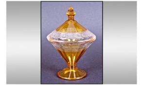 Art Deco Glass Vase And Cover. Of Conical form, raised on a circular base. Faceted, etched body
