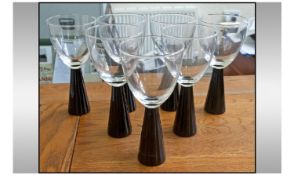 Set Of 7 Wine Glasses. Black Stems. Height 7.5 inches each.