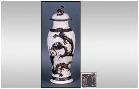 Chinese Crackle Ware Lidded Vase with an embossed dragon design. With a Foo dog finial and Chinese
