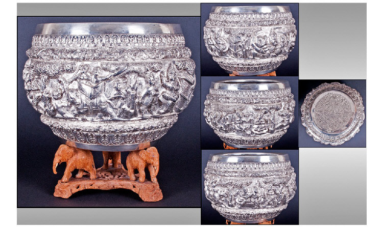 A Large And Impressive Indian Cast Silvered Metal Bowl. The finely hollow cast embossed body