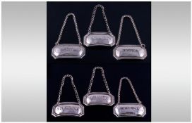 A Silver Set of Six Matching Spirit Labels, All Fully Hallmarked. Sherry, Brandy, Vodka, Bacardi,