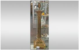 A Late 19th/Early 20th Century Brass Adapted Table Lamp. In the form of a corinthium column, with