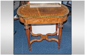 An Inlaid Walnut French Style Shaped Top Side Table with Ormulu gallery to the top on round reeded