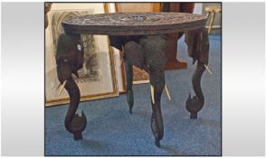 Burmese profusely carved oval topped teak elephant table
Legs in the form of elephant heads with