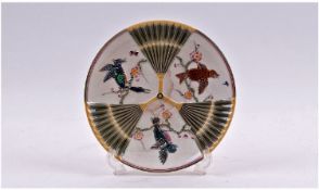 A Wedgewood Majolica Decorated Embossed Plate, with open fan design with panels of birds in cherry