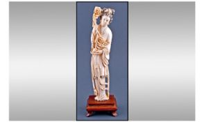 Chinese Late 19th Century Ivory Figure, of a woman of peace dressed in flowing robes and holding a