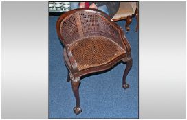 Mahogany Framed Bergee Tub Desk Chair on claw & ball legs, with carved knees. Circa 1910.