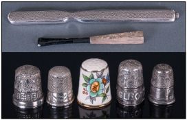 Collection Of Three Silver Thimbles. Plus one white metal thimble and a masons porcelain thimble.