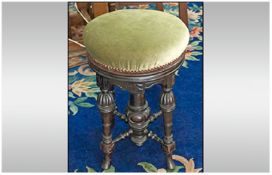 Late Victorian Piano Stool. Adjustable padded seat, raised on four turned and carved legs, with