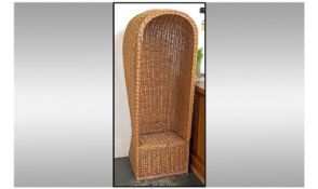 Contemporary Rattan Chair In The Form Of A Hotel Porters Chair.