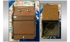 Edwardian Oak Fall Front Coal Scuttle with brass carrying handle with original brass shovel. With