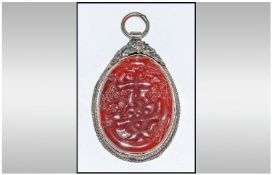 Carved stone Pendant.