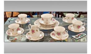 Melba Tea Service, Roses On White Ground Design. Comprising 5 cups, 6 saucers, milk jug, sugar bowl,