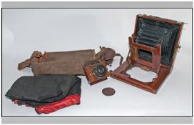 Early Mahogany Framed Bellows Camera. Brass mounts. Together with cloth cover and canvas bag, A/F