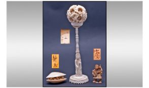 Chinese Carved Ivory Puzzle Ball On Stand, the outer of the several layers of carved globes, covered