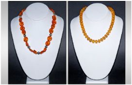 Two Modern Copal Amber Necklaces With Silvered Mounts. Each weighing 41 and 34 grams.