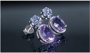 Amethyst and Tanzanite Drop Earrings, a purple 2ct oval cut  amethyst to each earring, suspended