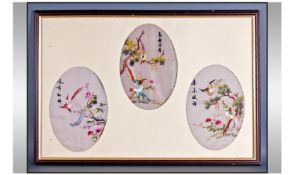 Framed In Glaze Oriental Picture. Three oval panels of silk embroidery, all depicting birds on