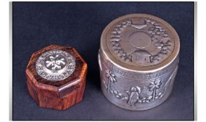 An African Cylindrical Silver Box, with pull off lid. Decorated in relief with native themes.