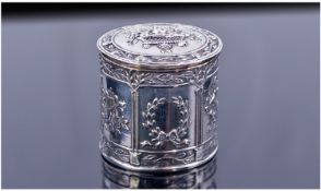 An Italian Silver Cylindrical Box. The hinged lid and sides decorated in fine relief with panels