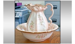 Staffordshire Ironstone Pottery Large Jug. Decorated with floral patterns to the body on pink