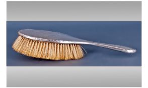 A Silver Brush hallmarked for Birmingham c 1930's. Engraved back plate.