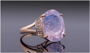 Lavender Quartz and Diamond Ring, the large, oval, faceted, pinkish lilac stone, with a mysterious