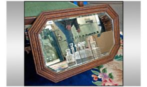 Octagonal Shaped Oak Mirror. Bevelled glass. Circa 1940's. 30 x 20 inches.