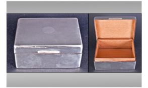 A Small Silver Cased Cigarette Box. Cedar Lined, hallmark rubbed.